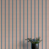 Wallpaper with vertical stripes in brown and blue on a plain background