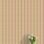 Striped wallpaper with a vase of flowers on a flat surface