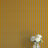 Striped wallpaper with a vase of flowers on a flat surface