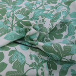 Fabric with green leaf pattern on a white background