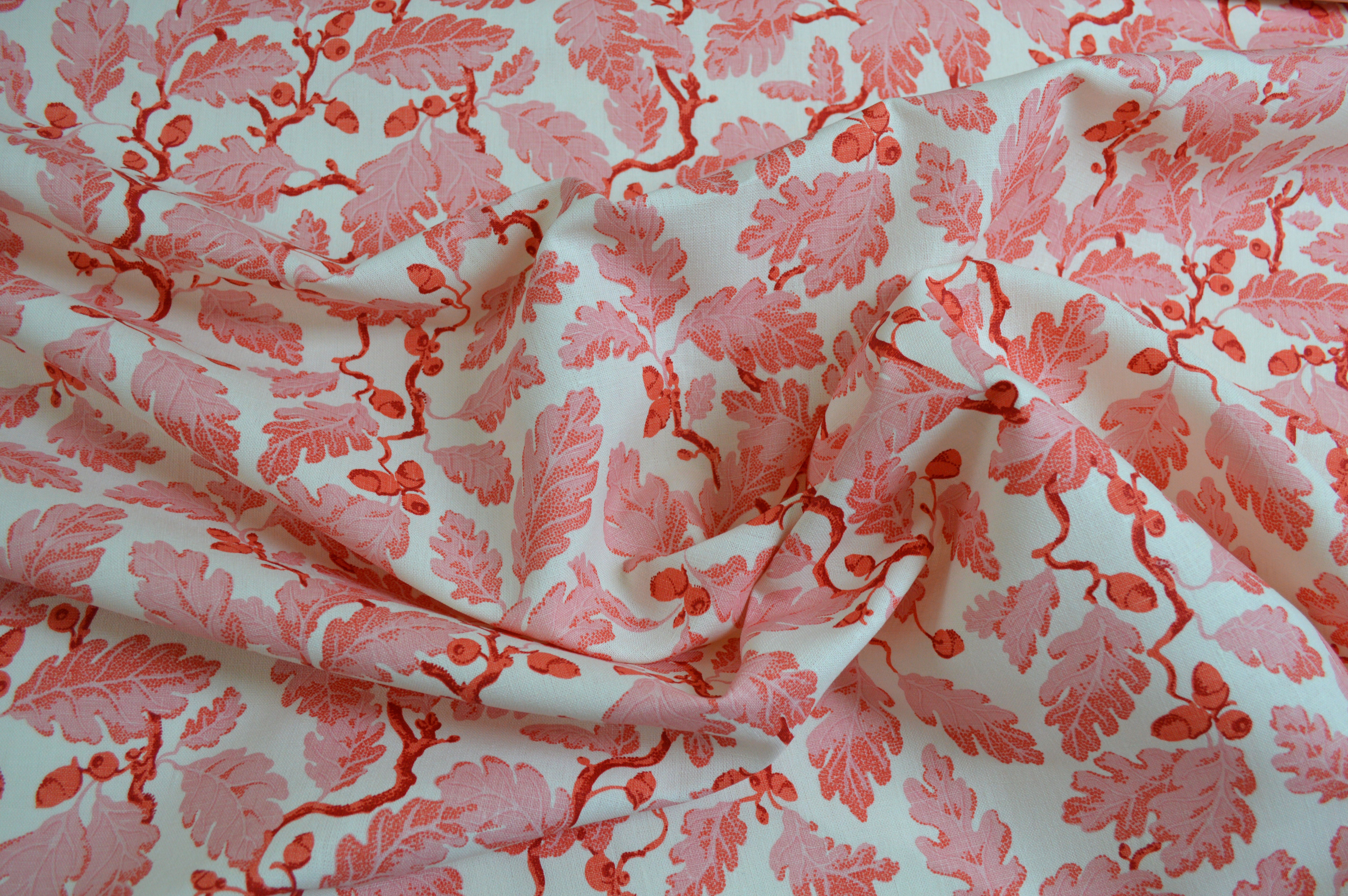 Pink floral patterned fabric on a white background