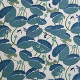 Pattern of blue lily pads and small creatures on a white background