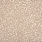 A close-up of a leopard print broadloom in beige and taupe spots on a cream background.