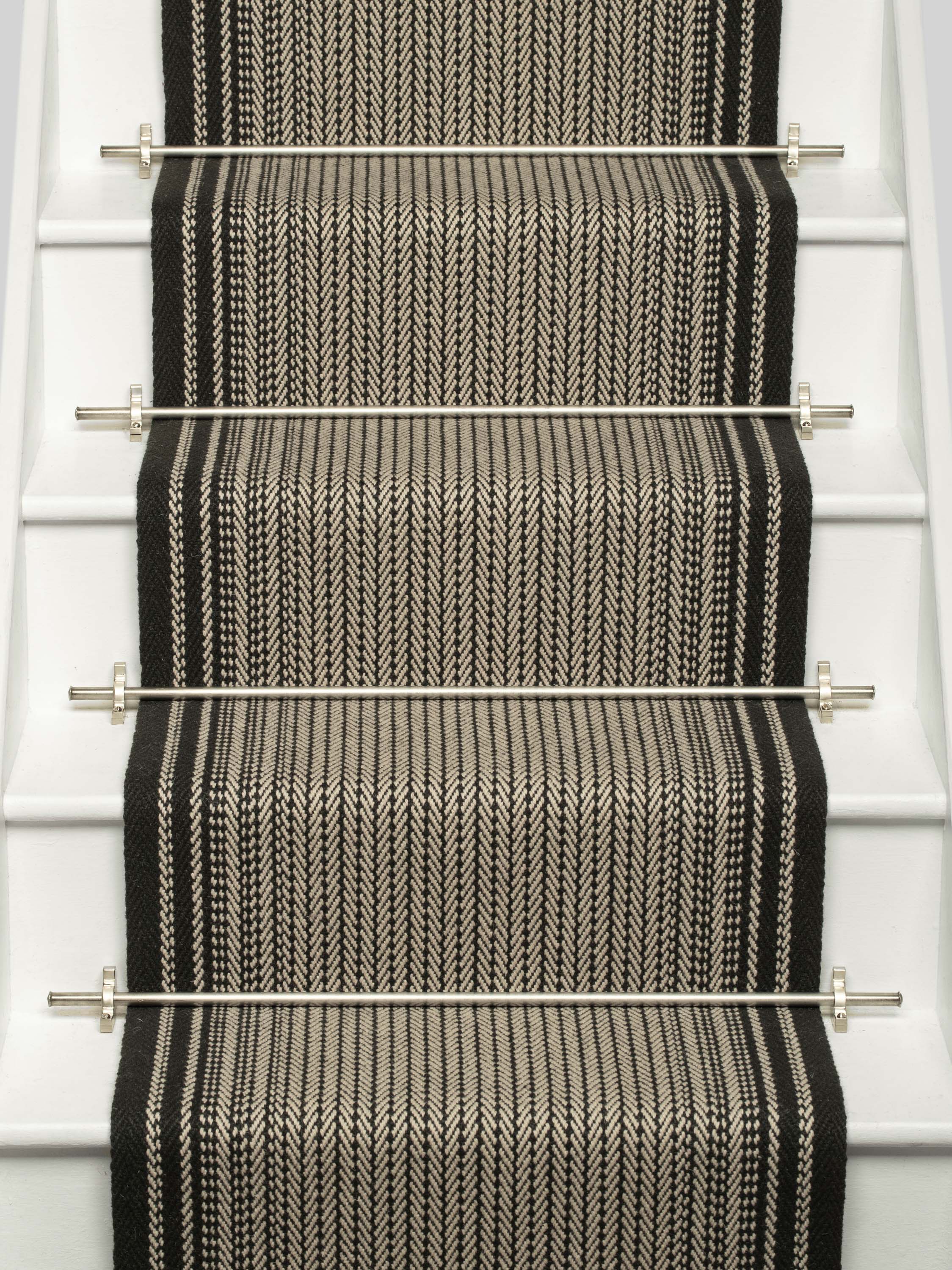 Striped flatweave runner in black and white on white staircase