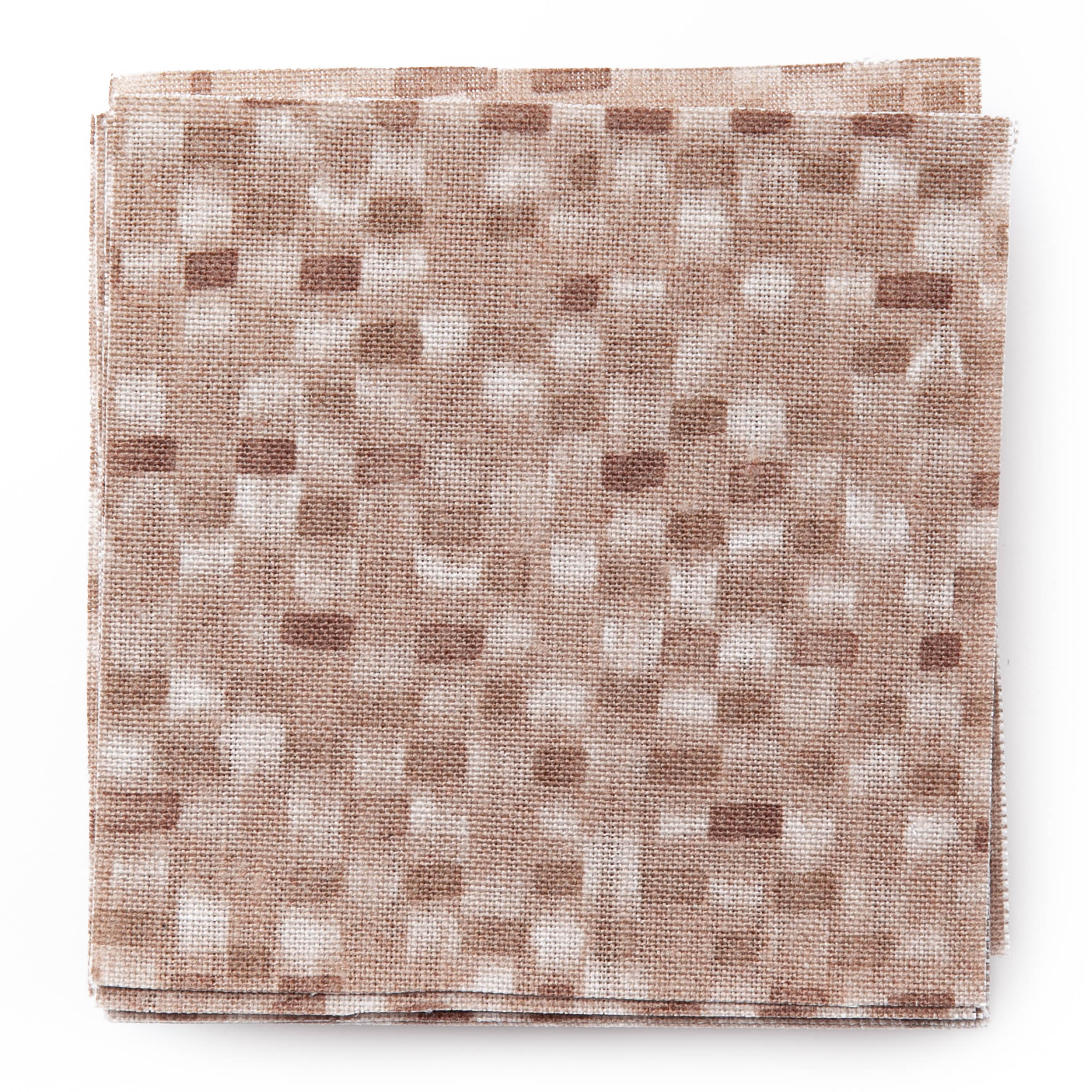 A stack of fabric swatches in a painterly checked pattern in shades of pink.