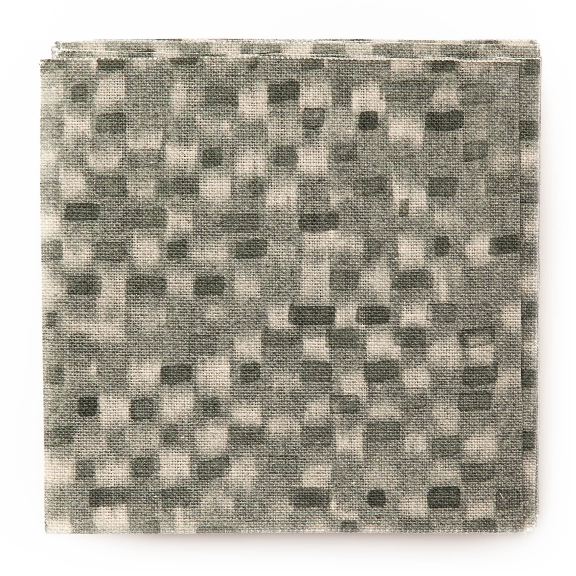 A stack of fabric swatches in a painterly checked pattern in shades of olive.