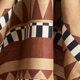Draped bold geometric printed fabric in brown and tan with black and white accents.
