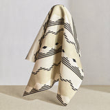 Hanging fabric piece in a graphic geometric design in ecru, cream and black. 