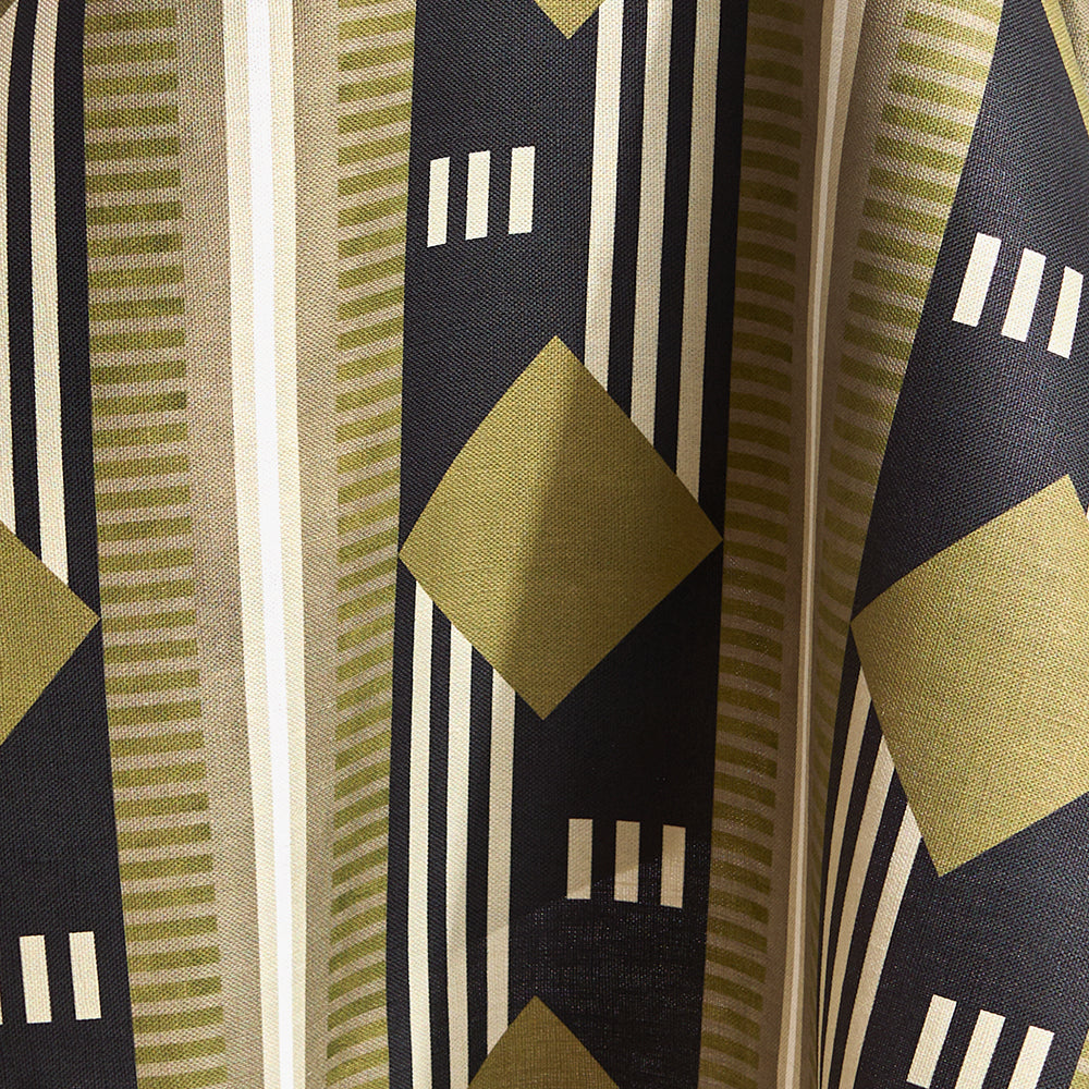 Draped fabric a graphic geometric design in sage green, taupe, white and black.