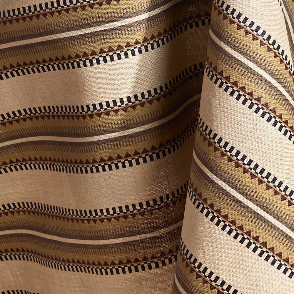 Fabric in a complex geometric stripe in brown, tan, orange, light purple and black on a cream field.