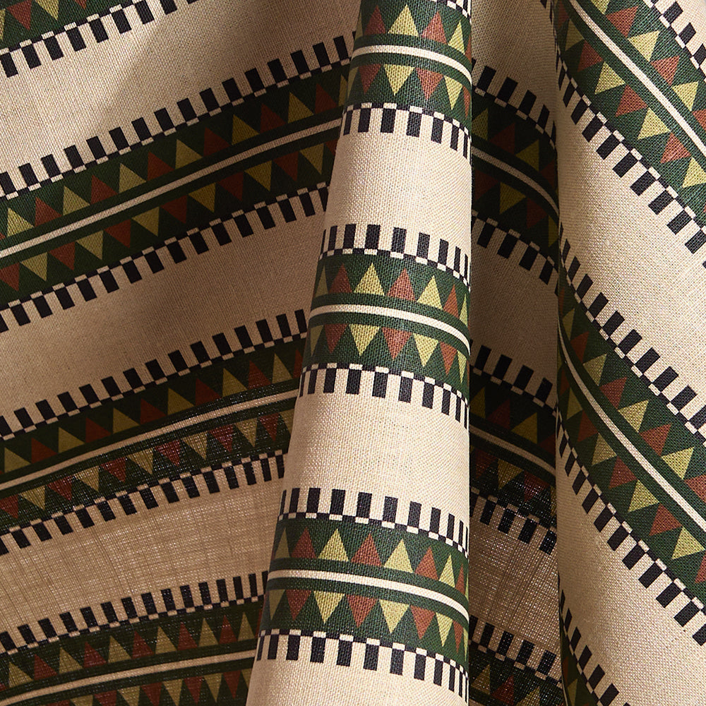 Fabric in a complex geometric stripe in green, brown and sage and black on a cream field.