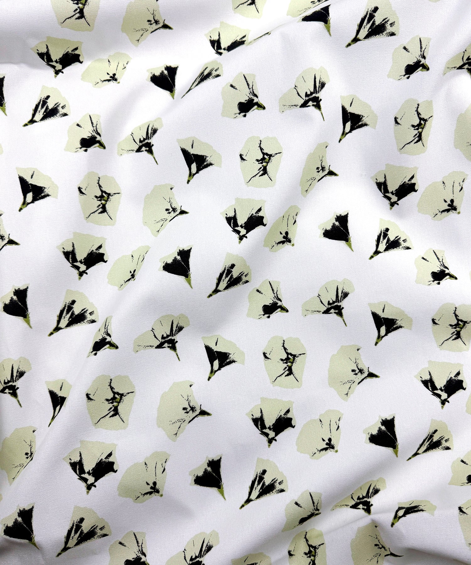 Floral patterned fabric with black and cream on a white background