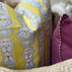 Detail of a printed yellow pillow. 
