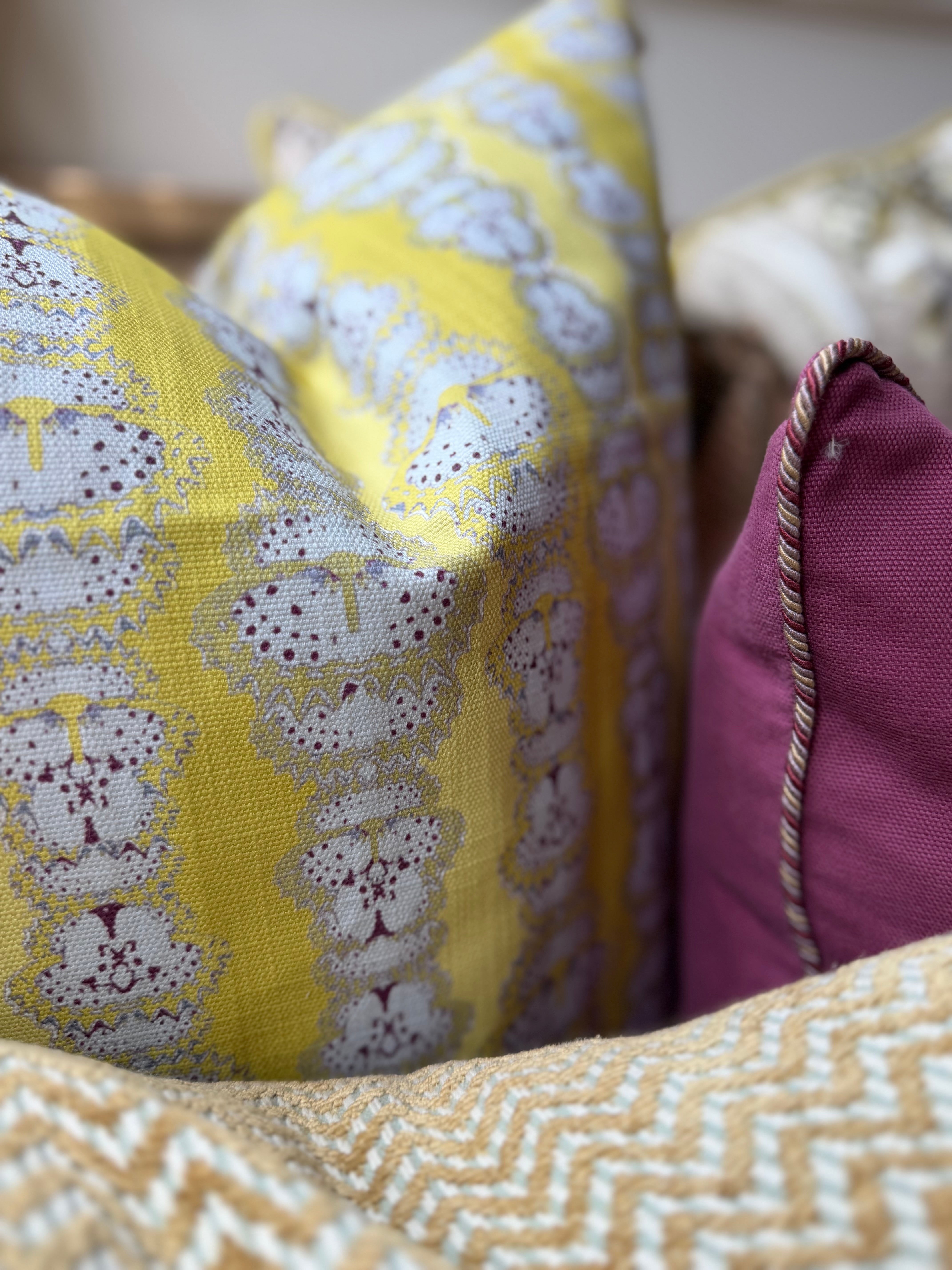 Detail of a printed yellow pillow. 