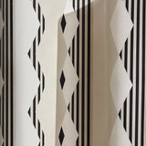 Wallpaper roll detail in a graphic geometric design in ecru, cream and black. 