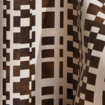 Wallpaper  in a modernist checkerboard pattern in brown and cream.