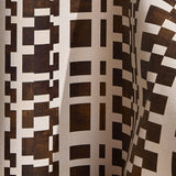 Wallpaper  in a modernist checkerboard pattern in brown and cream.