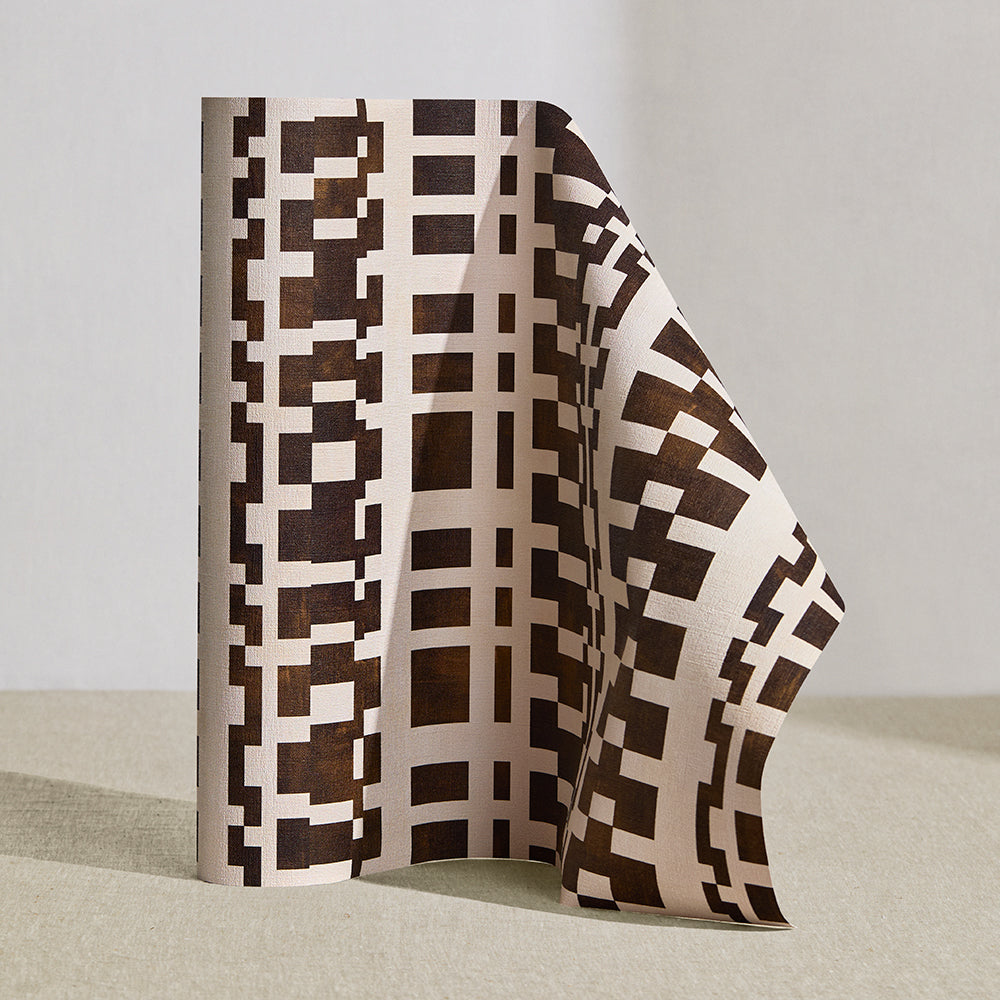 Wallpaper roll in a modernist checkerboard pattern in brown and cream.