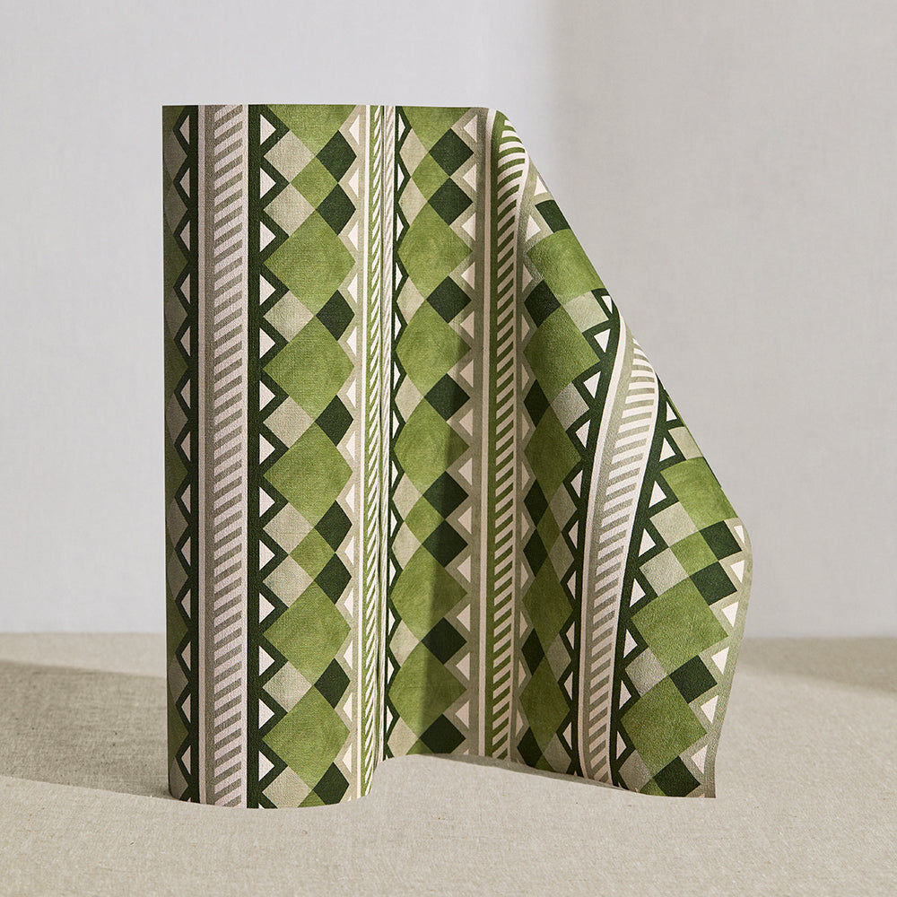 Wallpaper roll in a complex stripe with geometric shapes and chevrons in sage, olive ecru and cream.