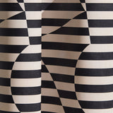 Wallpaper in a trompe l'oeil stripe pattern with geometric shapes in cream and black.