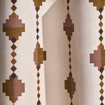 Wallpaper in a stacked diamond stripe design in pink and ochre with purple accents.