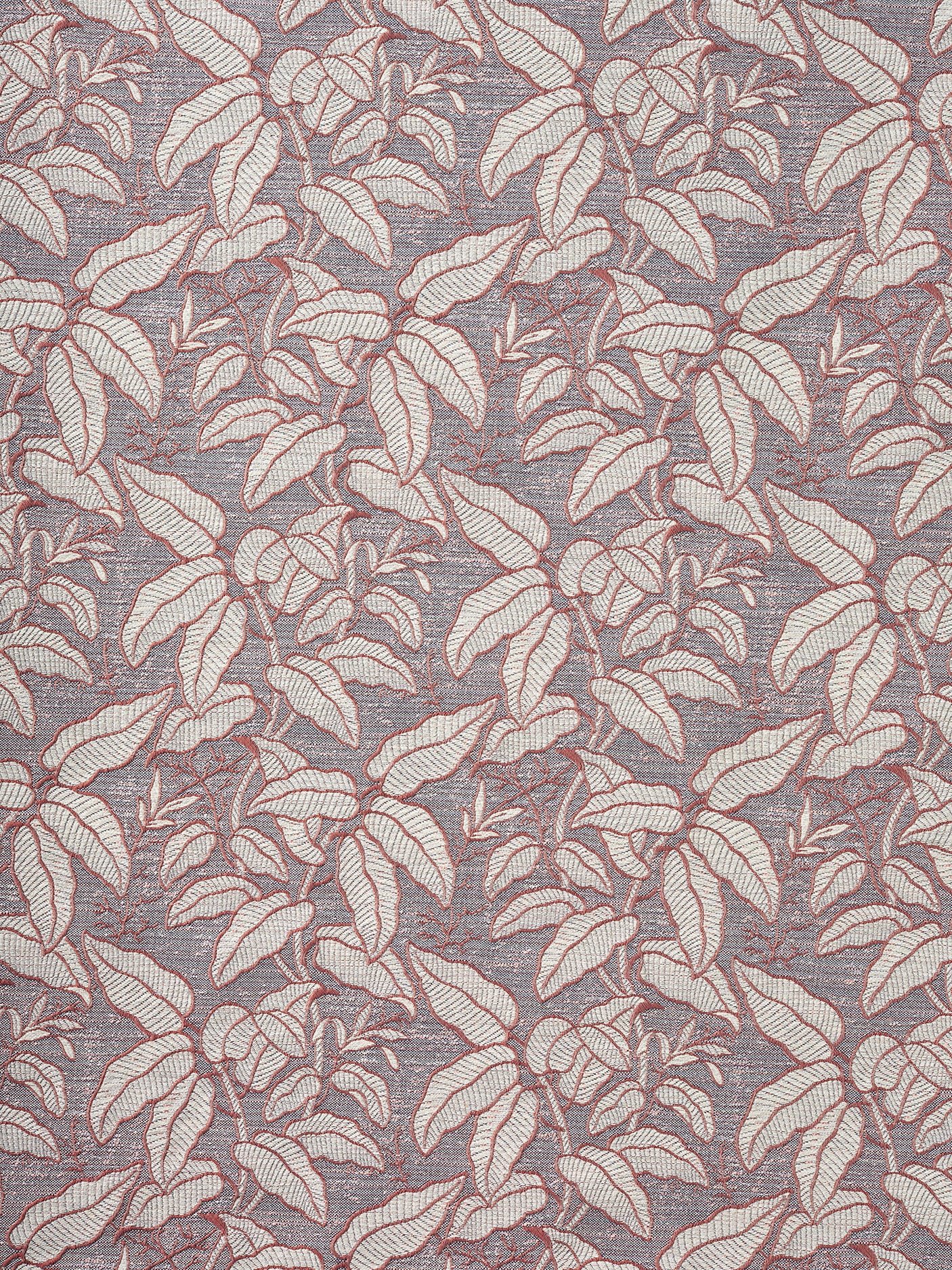 A close-up of a woven fabric pattern featuring a dense botanical leaf design in soft grey with warm pink outline on a grey-blue field. 