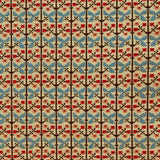 Patterned fabric with a gridded floral design in blue, orange and brown. 