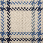 Broadloom carpet in a windowpane plaid in shades of blue on a beige field.