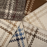 Stack of windowpane plaid broadloom samples in array of handsome colors.