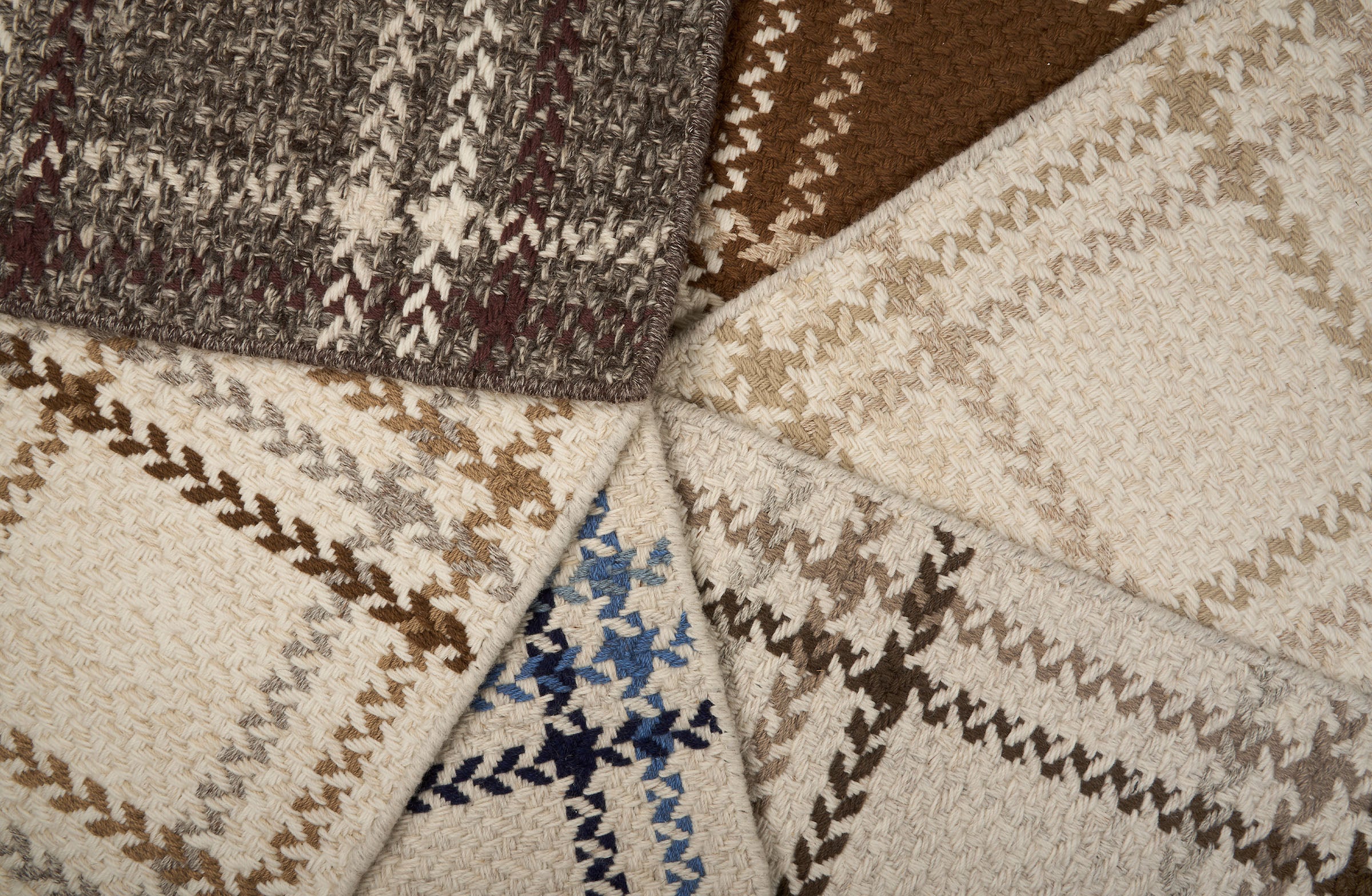 Stack of windowpane plaid broadloom samples in array of handsome colors.