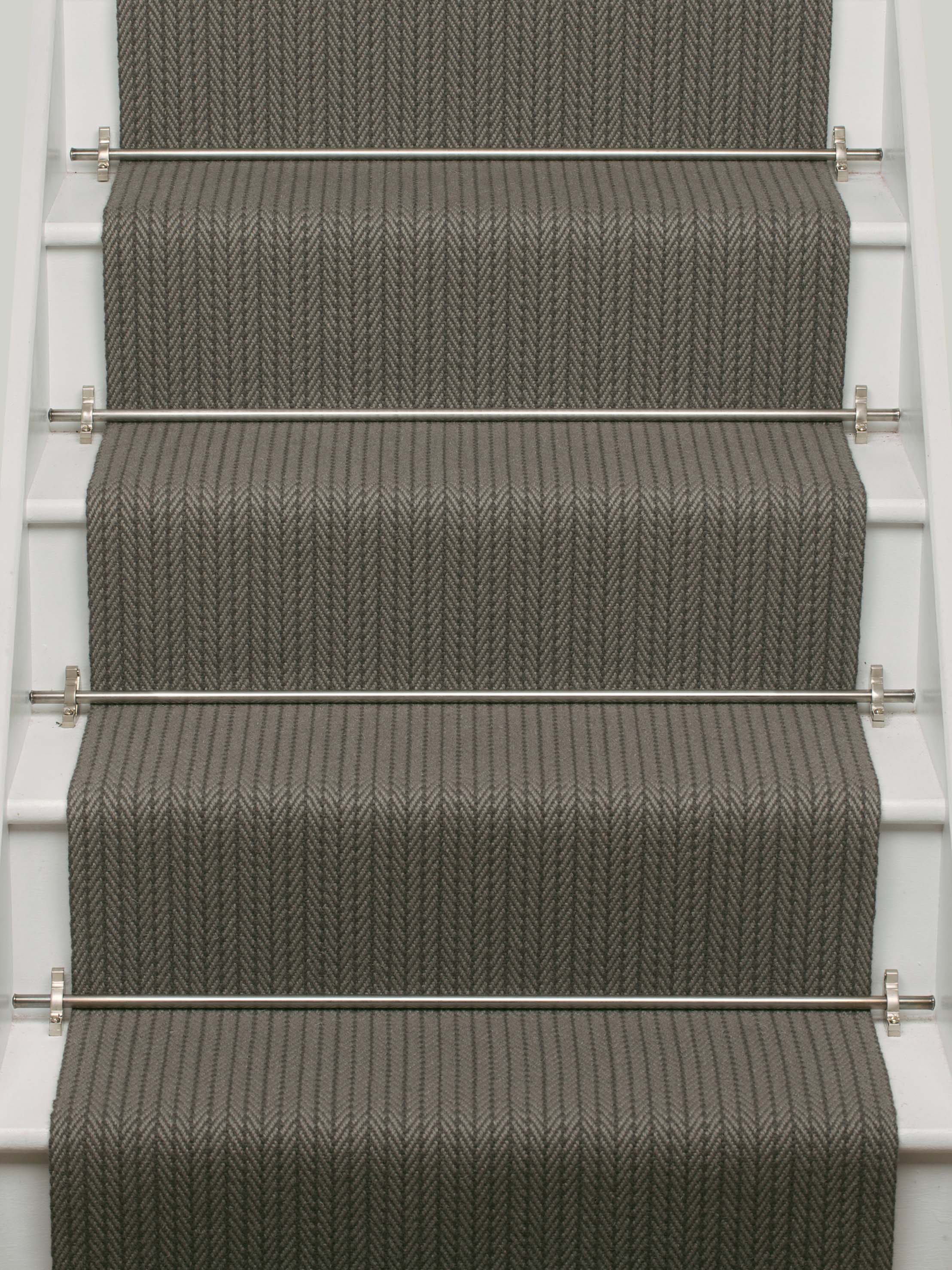 Striped flatweave runner in dark grey on white staircase