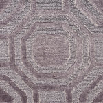 Close-up of textured metallic carpet with geometric pattern
