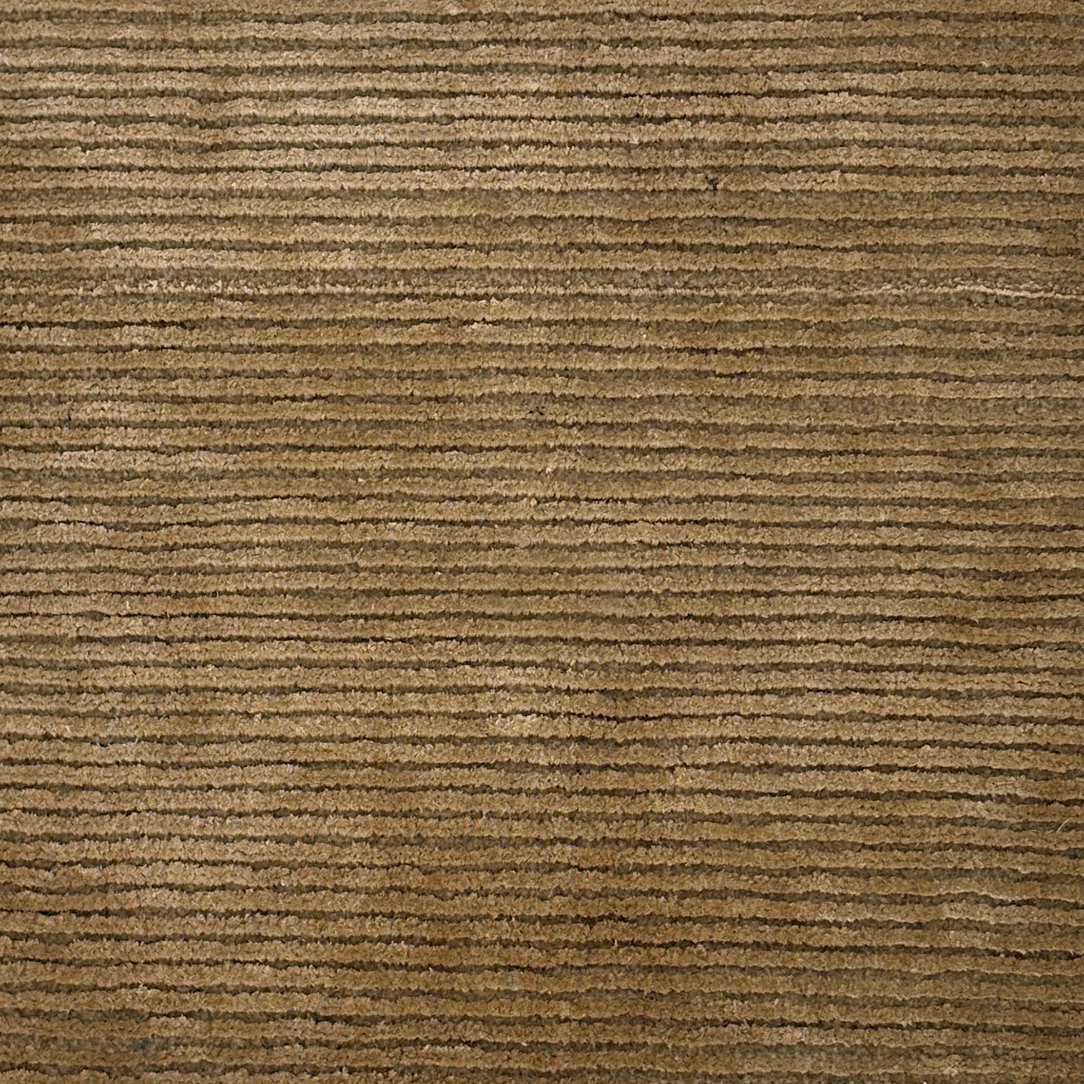 Handknotted rug with a rubbed stripe in light brown. 