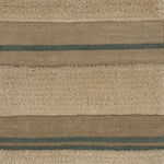 Handwoven rug in beige, cream and blue with raised cut pile stripes.