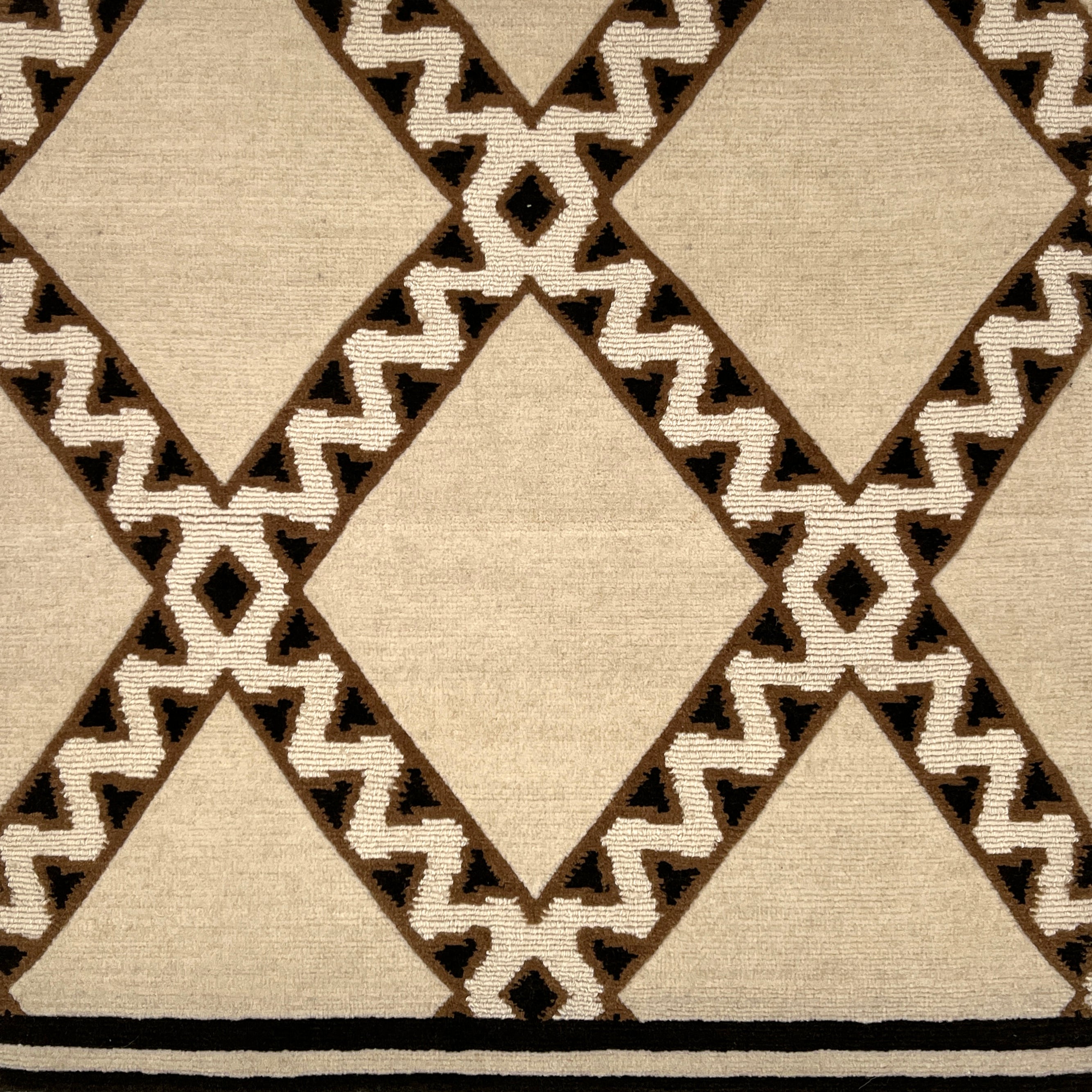 Close-up of a patterned rug with geometric design