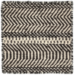 Black and white zigzag patterned rug with boundedges