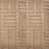 Detail of a Handknotted rug in beige with a raised linear pattern. 