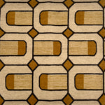 Close-up of a patterned rug with brown and beige colors