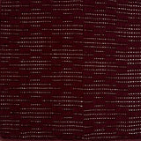 Close-up of a maroon rug with raised lattice pattern