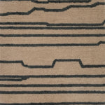 Handknotted rug with an abstract line in grey on a cream field. 
