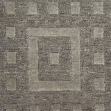Close-up of a textured brown carpet with geometric pattern