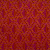 Detail of a woven high-pile rug in an interlocking diamond pattern in pink, red and orange