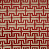 Red and beige geometric patterned handknotted rug
