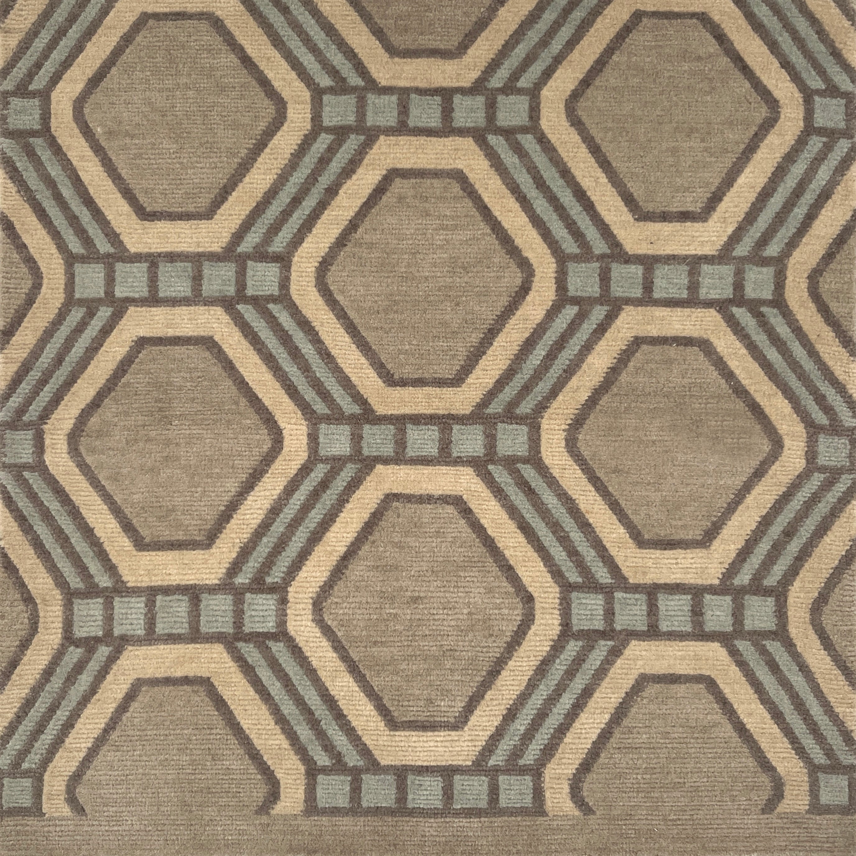 Detail of a hexagonal patterned rug in brown and gray tones