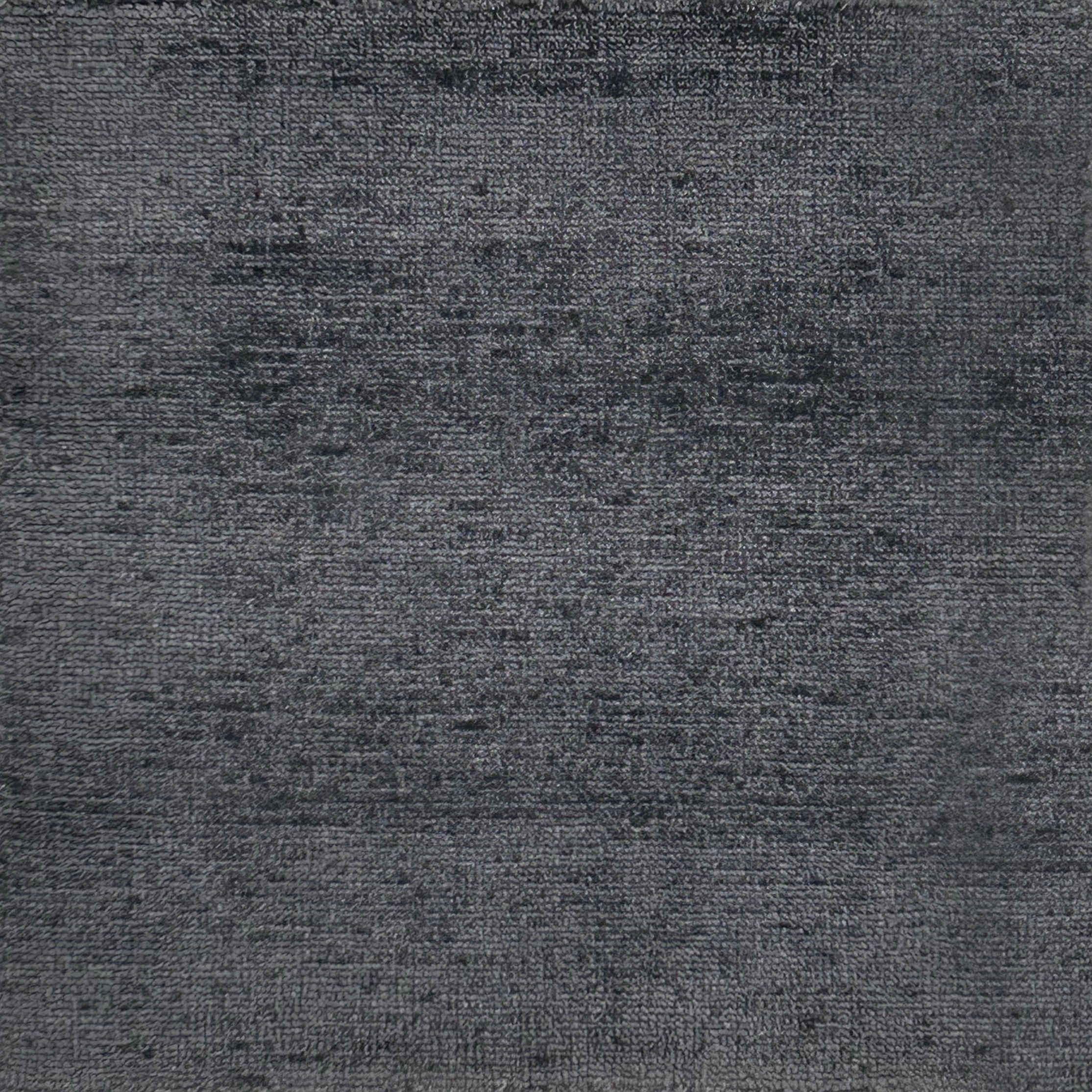 Handknotted rug in charcoal grey. 