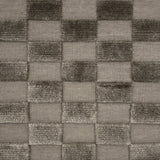 Handwoven rug with raised checkerboard cut pile squares in grey