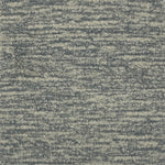 Handknotted cut pile rug in heathered grey.
