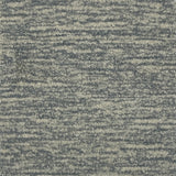 Handknotted cut pile rug in heathered grey.