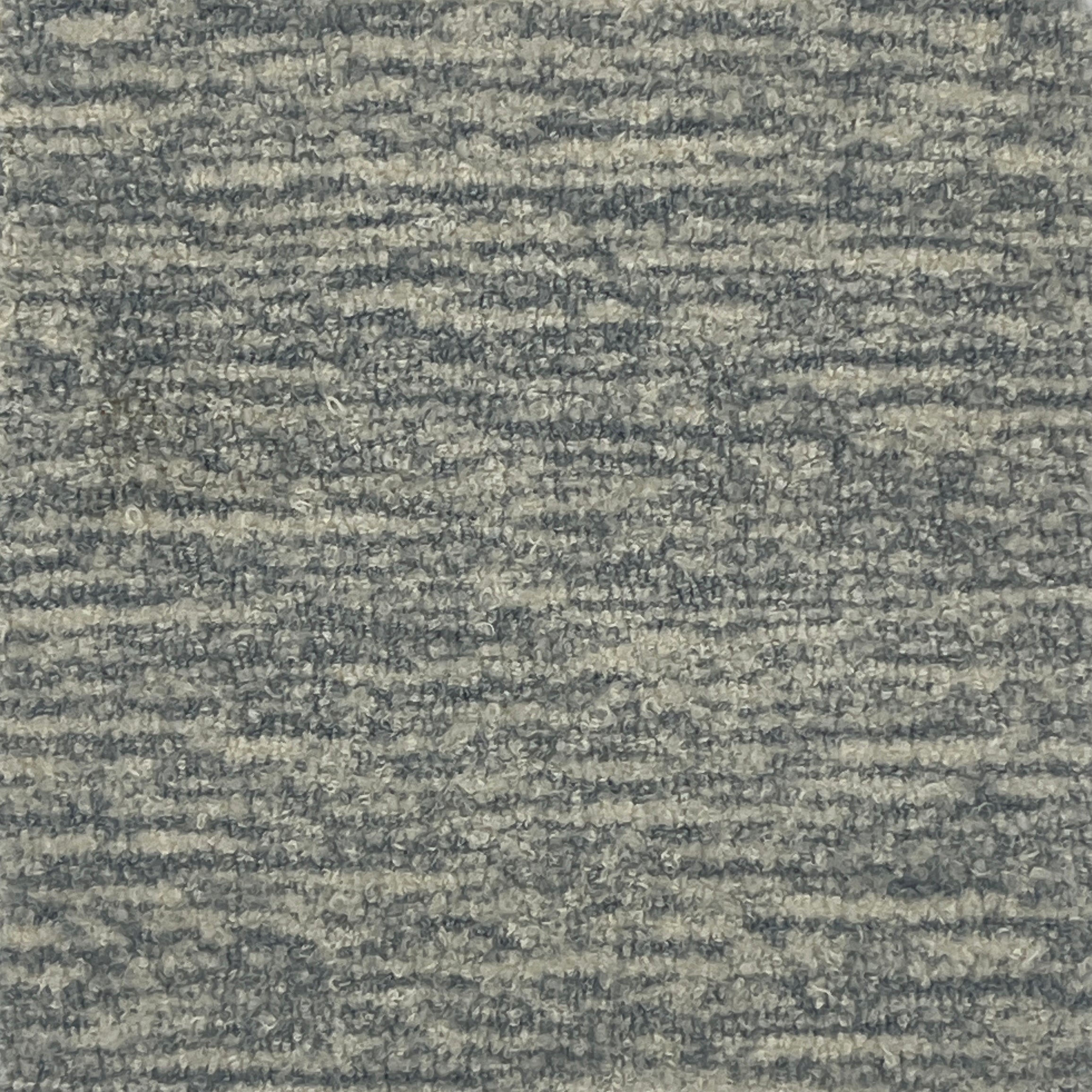 Handknotted cut pile rug in heathered grey.