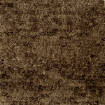 Handknotted cut pile rug in mottled brown.
